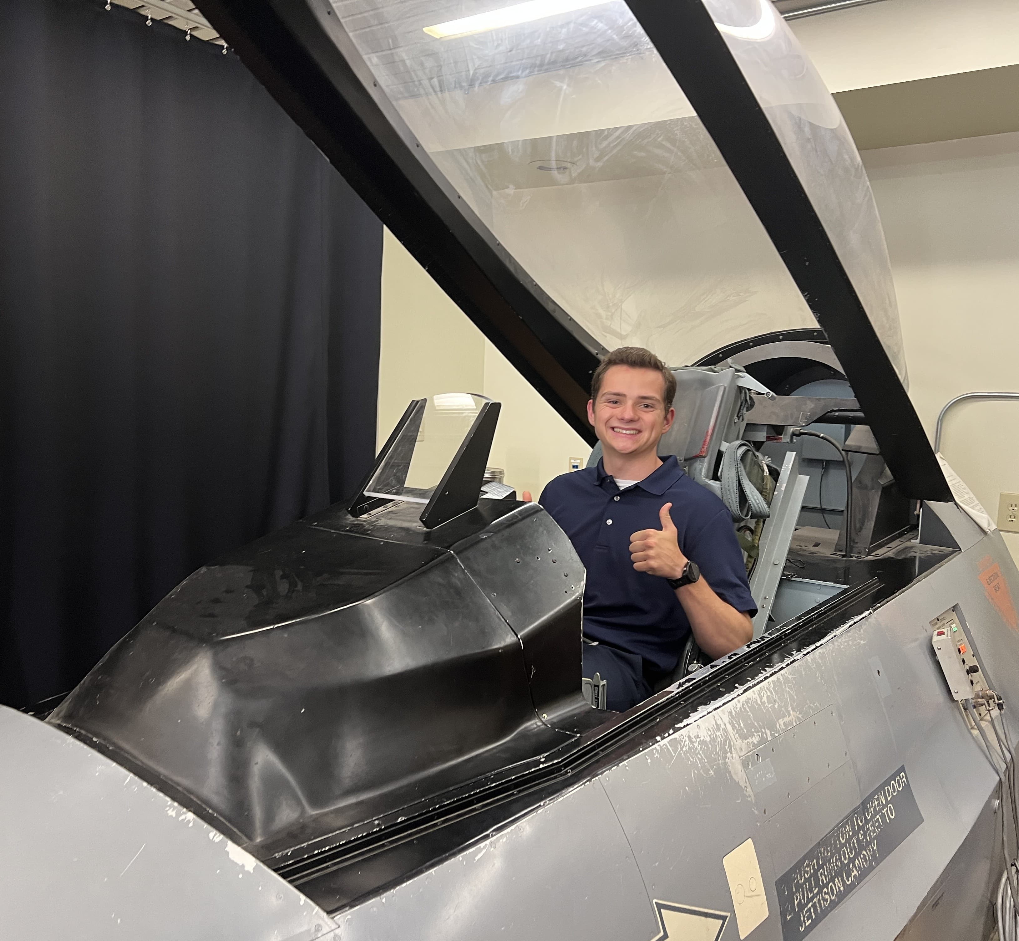 Seated in an aircraft cockpit at NASA Armstrong