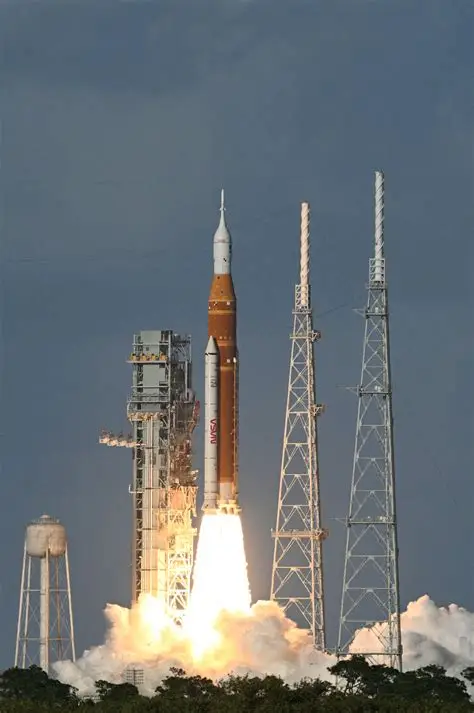NASA Space Launch System rocket lifting off from the launch pad